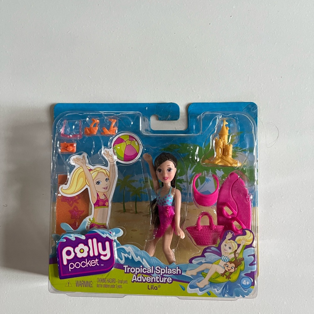 New in Package Rare Polly Pocket Tropical
Splash Adventure-Lila 2009